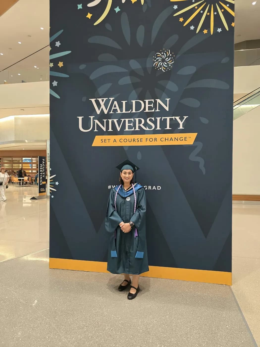 Jasraj in her graduation gown at the Walden University commencement