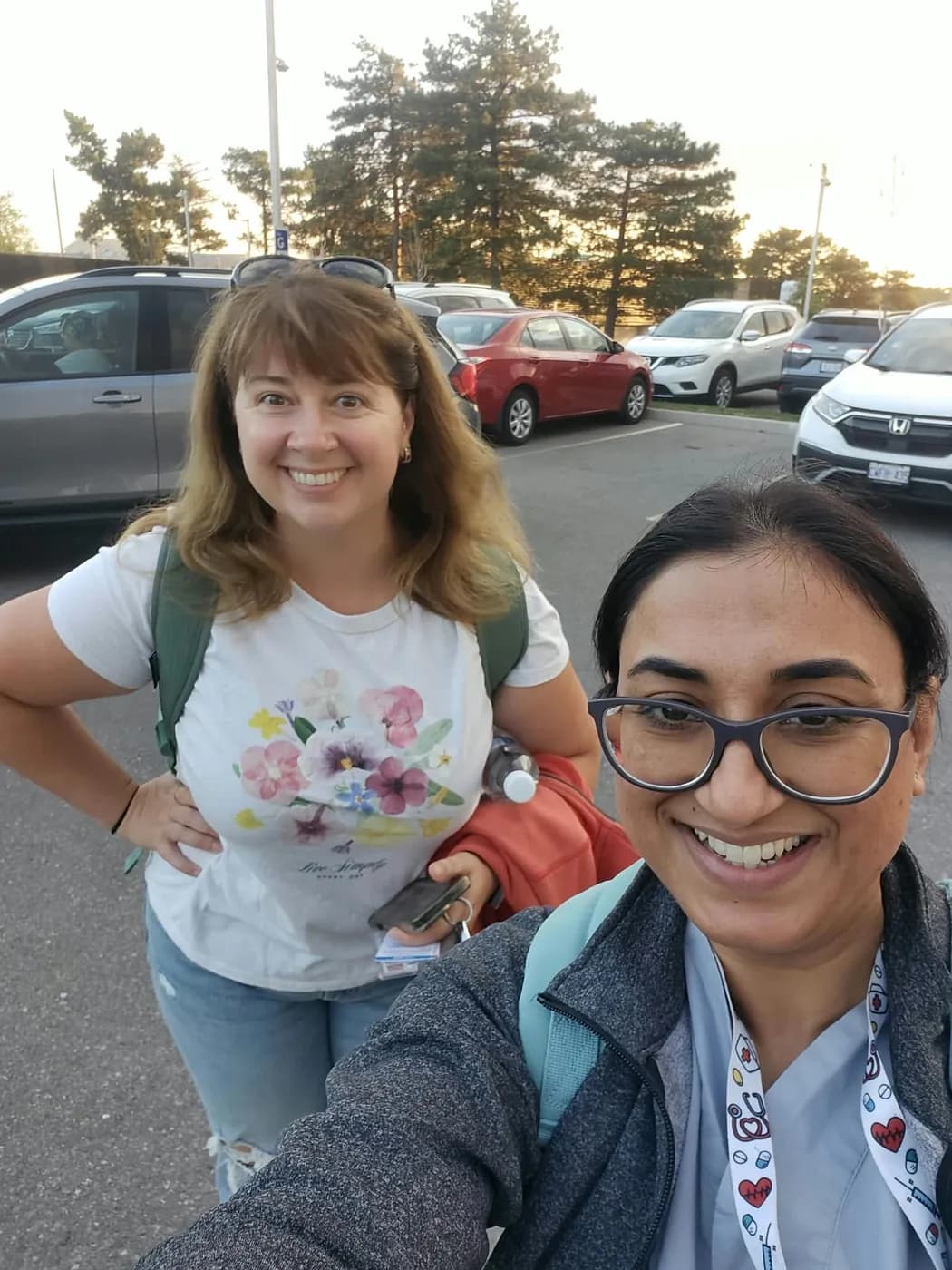 Jasraj taking a selfie outdoors with a smiling colleague