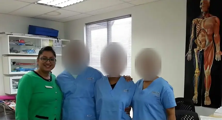 Jasraj with three of her nursing students in a skills lab